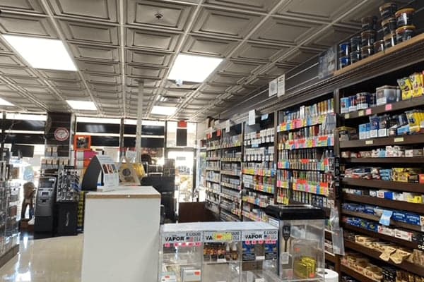 The counter at Smokey News with the shelves behind it.